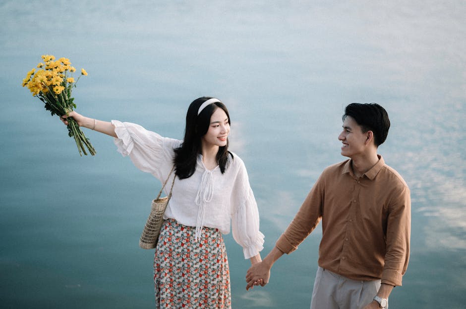A happy couple holding flowers representing life milestones
